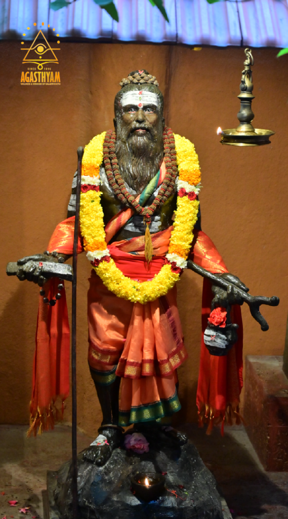 Statue of Sage Agasthya adorned with garlands at Agasthyam Kalari, honouring the sage's legacy in Kalaripayattu