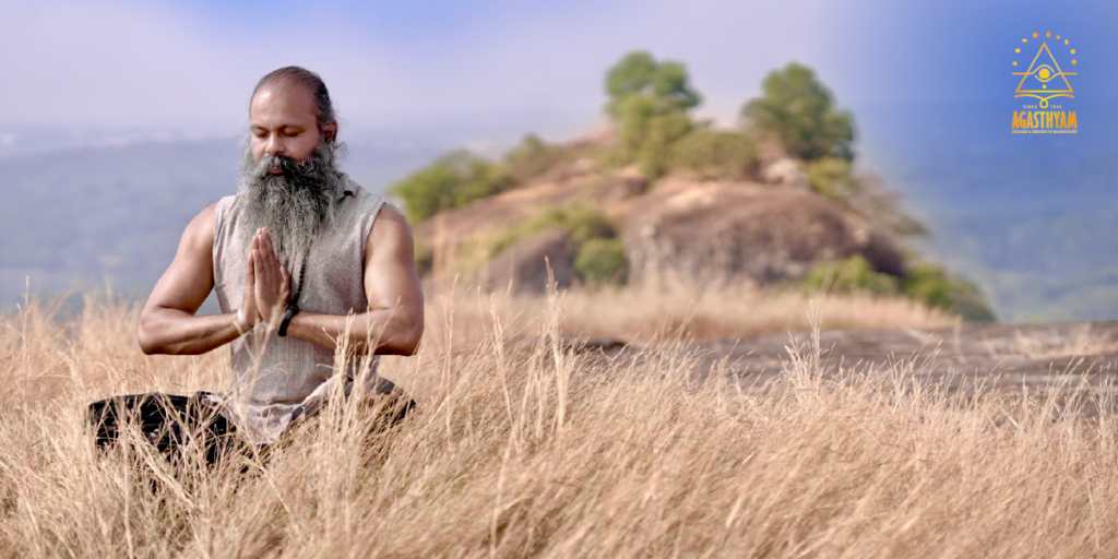 Kalaripayattu master meditating on a hilltop, reflecting the balance of body and mind in Kalari training